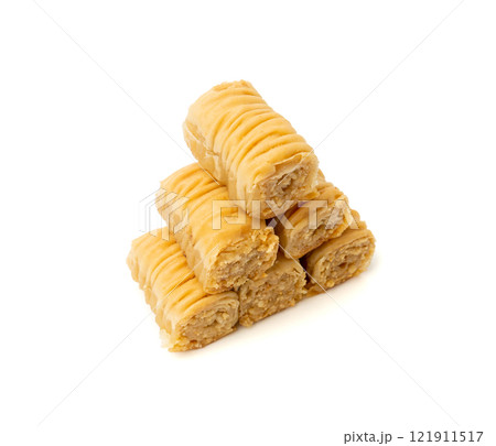 Rolled Baklava Isolated, Ramadan Dessert Roll on Restaurant Plate, Eastern Sweet Pastries Rolled Baklava Isolated, Ramadan Dessert Roll on Restaurant Plate, Eastern Sweet Pastries 121911517
