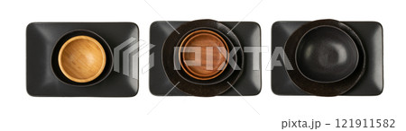 Empty Black Bowls and Wood Plates on Wooden Table Background, Black Plate Mockup Top View Empty Black Bowls and Wood Plates on Wooden Table Background, Black Plate Mockup Top View 121911582