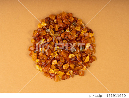 Amber stones, polished orange gemstones, natural Baltic amber gems, golden fossilized tree resin Amber stones, polished orange gemstones, natural Baltic amber gems, golden fossilized tree resin 121911650