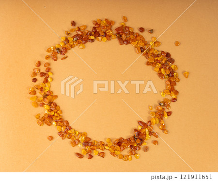 Amber stones, polished orange gemstones, natural Baltic amber gems, golden fossilized tree resin 121911651