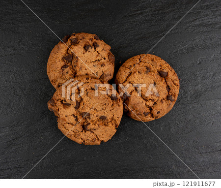 Chocolate chips pile cookies , American biscuits, cocoa confectionery cake, sweet morsels bakery Chocolate chips pile cookies , American biscuits, cocoa confectionery cake, sweet morsels bakery 121911677