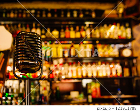 Bar counter and blurred background with alcohol bottles. 121911789