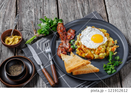 Bubble and Squeak with bacon, toasts, fried egg 121912612