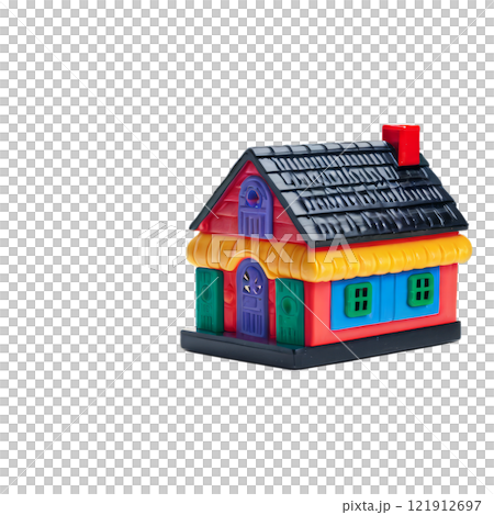 Colorful toy house made of plastic bricks placed on a green base for childrens playtime activities 121912697