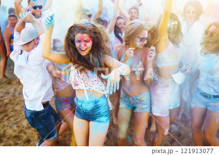 A group of friends have fun, dance at the holi festival. Celebrating traditional indian spring holiday. Friendship. A group of friends have fun, dance at the holi festival. Celebrating traditional indian spring holiday. Friendship. 121913077