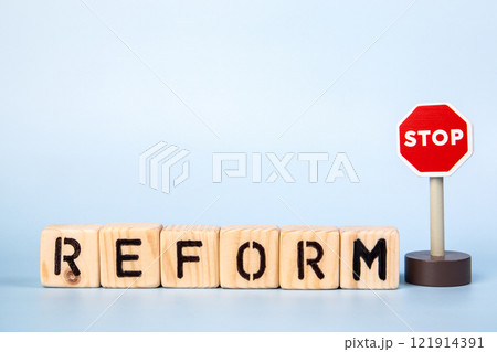 Stop Reform. Word from wooden alphabet blocks on a light background Stop Reform. Word from wooden alphabet blocks on a light background 121914391