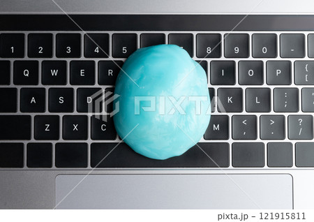 Big slime compound on black keyboard 121915811