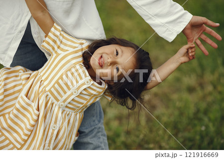 Family in a summer field. Sensual photo. Cute little girl. Family in a summer field. Sensual photo. Cute little girl. 121916669