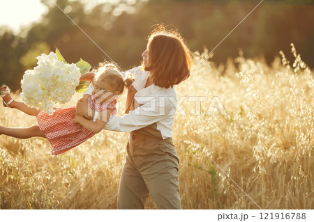 Family in a summer field. Sensual photo. Cute little girl. 121916788