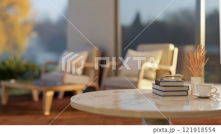A round marble table featuring space for product display, with a blurred background of a living room 121918554