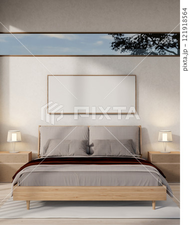 A contemporary, minimalist bedroom featuring a comfy bed with grey bedding and sleek home decor. 121918564