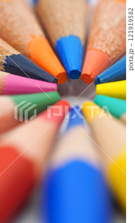 A close-up of vibrant colored pencils arranged in a circular pattern, ideal for use in educational materials, creative design projects, or promoting artistic activities. A close-up of vibrant colored pencils arranged in a circular pattern, ideal for use in educational materials, creative design projects, or promoting artistic activities. 121919582