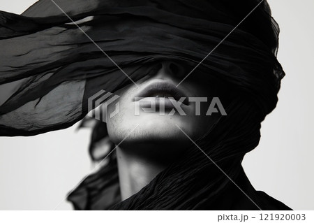 Portrait of a beautiful man with a black scarf on head Portrait of a beautiful man with a black scarf on head 121920003