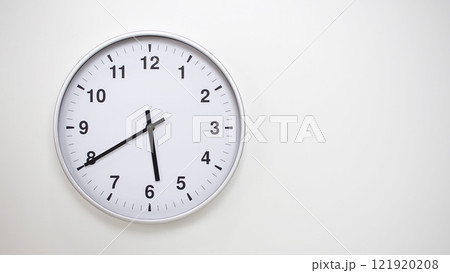Minimalist White Clock with Silver Frame Striking 17.40/05.40 on White Background. Perfect for Time Management and Corporate Campaigns Minimalist White Clock with Silver Frame Striking 17.40/05.40 on White Background. Perfect for Time Management and Corporate Campaigns 121920208