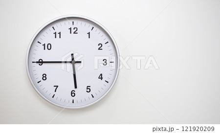 Minimalist White Clock with Silver Frame Striking 17.45/05.45 on White Background. Perfect for Time Management and Corporate Campaigns 121920209