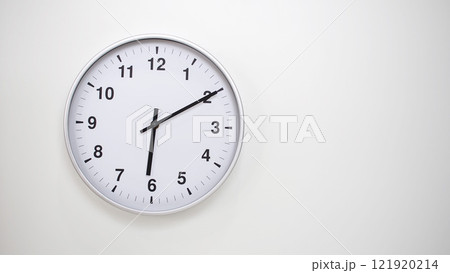 Minimalist White Clock with Silver Frame Striking 18.10/06.10 on White Background. Perfect for Time Management and Corporate Campaigns 121920214