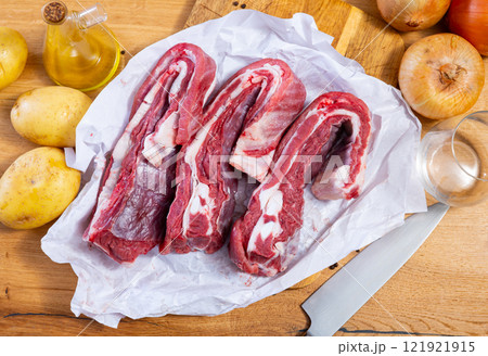 Raw beef brisket served at table 121921915