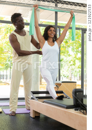 Aerobics pilates women with rubber bands closeup 121922533