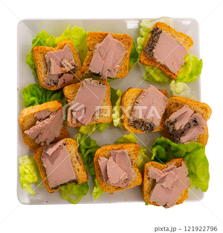 There are sandwiches with meat pate and china cabbage leaves. 121922796