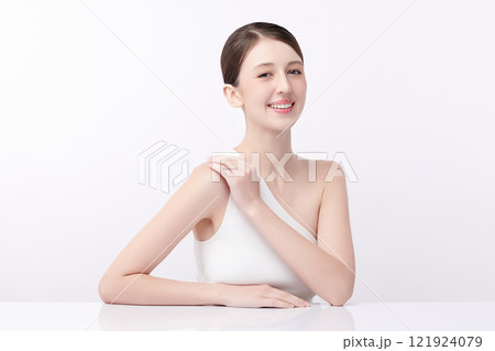 Beautiful young woman with clean fresh skin on white background, Face care, Facial treatment, Cosmetology, beauty and spa, women portrait. Beautiful young woman with clean fresh skin on white background, Face care, Facial treatment, Cosmetology, beauty and spa, women portrait. 121924079