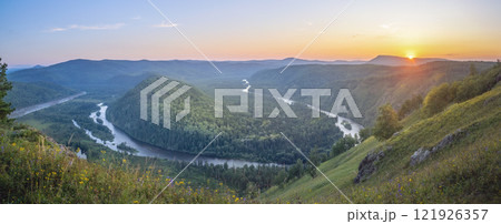 Breathtakingly Stunning Sunrise Over a Winding River Set in a Lush and Vibrant Green Landscape 121926357