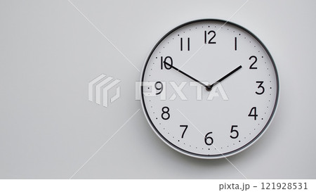 Minimalist Analog Wall Clock with White Face and Simple Black Hands Showing 13.50/01.50 - Ideal for Time Management and Modern Decor Concepts 121928531