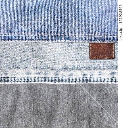 Vertical background with blue and gray denim texture with a seam and old leather label. Jeans material of blue and grey color and vintage tag of brown color. Mock up template. Copy space for text Vertical background with blue and gray denim texture with a seam and old leather label. Jeans material of blue and grey color and vintage tag of brown color. Mock up template. Copy space for text 121928568
