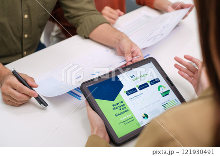 asian financial advisor presenting charts and data on a tablet during couple client meeting.financial planning and decision-making asian financial advisor presenting charts and data on a tablet during couple client meeting.financial planning and decision-making 121930491