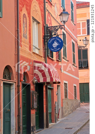 Bar sign on house. Street in Liguria. City buildings on sunny day. Travelling, sightseeing and holidays in Italy. 121931245