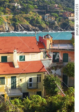 House roof near sea in Liguria. City buildings on sunny day. Travelling, Italy attractions and holidays House roof near sea in Liguria. City buildings on sunny day. Travelling, Italy attractions and holidays 121931255