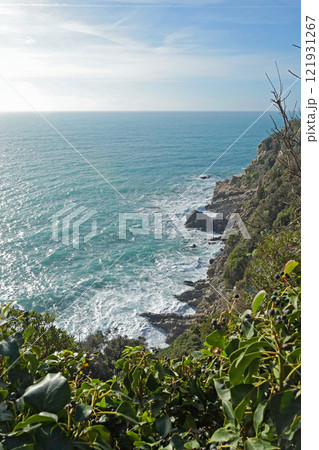Sea and rock on sunny day. Waves and nature of Mediterranean. Background for design.  121931267