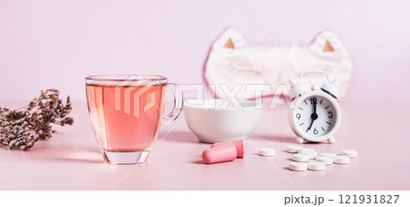 Concept insomnia accessories and sleep medications on pink web banner 121931827