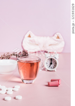 Insomnia remedies and sleep accessories on the table  vertical view 121931829