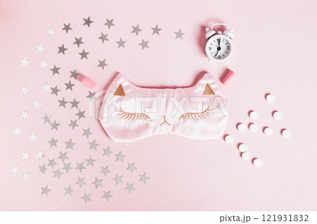 Concept good sleep, sleeping pills, sleep mask and stars on pink background 121931832