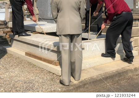 Porters lower the coffin into the grave Porters lower the coffin into the grave 121933244
