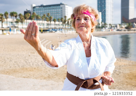 Mature lady in kimono outdoors Mature lady in kimono outdoors 121933352