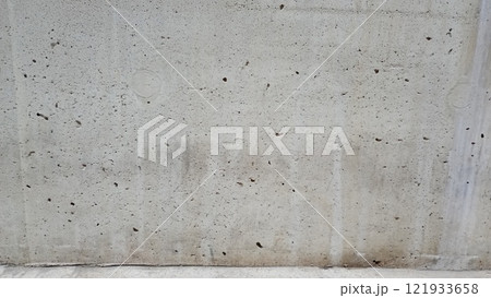 Close up of a weathered concrete surface with visible pores and grains. Ideal for industrial or rustic designs 121933658