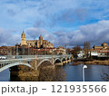 Salamanca. View of Salamanca and the Enrique Estevan bridge from the dock viewing point over the Tormes River. Traditional stone buildings. Salamanca Cathedral. SALAMANCA, SPAIN. 13 JANUARY 2025. 121935566