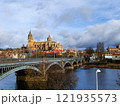 Salamanca. View of Salamanca and the Enrique Estevan bridge from the dock viewing point over the Tormes River. Traditional stone buildings. Salamanca Cathedral. SALAMANCA, SPAIN. 13 JANUARY 2025. 121935573