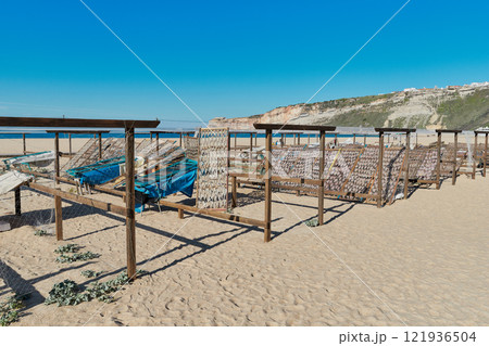 Traditional fish-drying on the beach of Nazare, Portugal 121936504