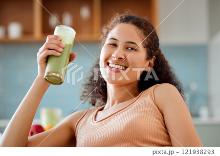 Green smoothie, drink and healthy juice for weight loss, detox or breakfast diet in home living room. Portrait of smiling, happy woman drinking fruit or vegetarian beverage with vitamins or nutrition 121938293