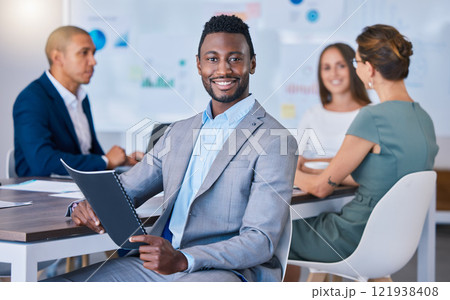 Portrait of a confident business man leading a meeting in a modern office, smiling and empowered. Happy black male discussing innovative strategies, marketing, planning and creative startup strategy 121938408