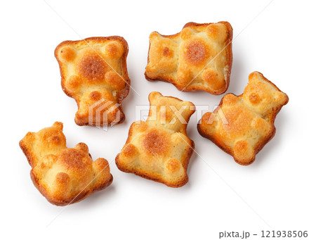 Sweet bear-shaped treats on a white background, perfect for parties and snacks, made with fluffy cake batter and a golden crust 121938506