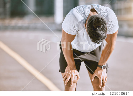 Tired man resting after fitness run, taking a break from cardio training and doing wellness exercise on the road in the urban city. Exhausted and fit sports person doing routine workout in street Tired man resting after fitness run, taking a break from cardio training and doing wellness exercise on the road in the urban city. Exhausted and fit sports person doing routine workout in street 121938614