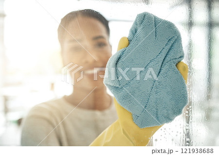 Woman cleaning window, with a cloth in rubber gloves and washing the shower cabin. Glass, hygiene and a female maid or cleaner scrubbing with a special spray and fabric doing chores. Woman cleaning window, with a cloth in rubber gloves and washing the shower cabin. Glass, hygiene and a female maid or cleaner scrubbing with a special spray and fabric doing chores. 121938688