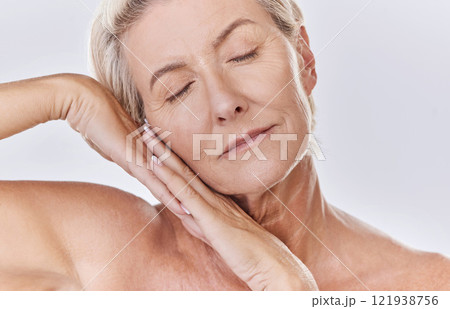 Skincare, beauty and wellness with health, skin and face of a senior woman in a studio on a purple background. Relax, spa and skin care with an elderly, calm model feeling healthy, happy and natural 121938756