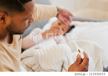 Sick, cold and flu of sick child with caring and loving parent taking temperature of his daughter. Father on family responsibility leave to care, love and treat his little girl with fever at home. Sick, cold and flu of sick child with caring and loving parent taking temperature of his daughter. Father on family responsibility leave to care, love and treat his little girl with fever at home. 121939253