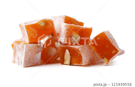 Delightful orange Turkish delight cubes with nuts arranged together on a clean surface Delightful orange Turkish delight cubes with nuts arranged together on a clean surface 121939558