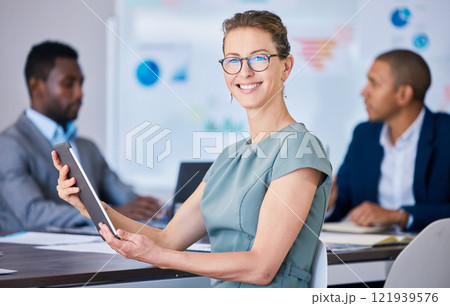 Boardroom executive, leader and manager browsing on tablet during meeting in an office. Portrait of a smiling, proud and caucasian entrepreneur, motivated business woman and ceo in a corporate agency Boardroom executive, leader and manager browsing on tablet during meeting in an office. Portrait of a smiling, proud and caucasian entrepreneur, motivated business woman and ceo in a corporate agency 121939576