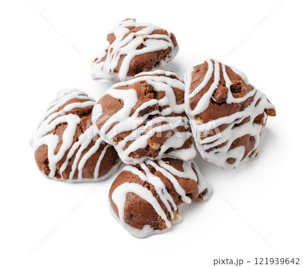 Delicious chocolate cookies with white icing arranged on a clean background for a tempting dessert display 121939642